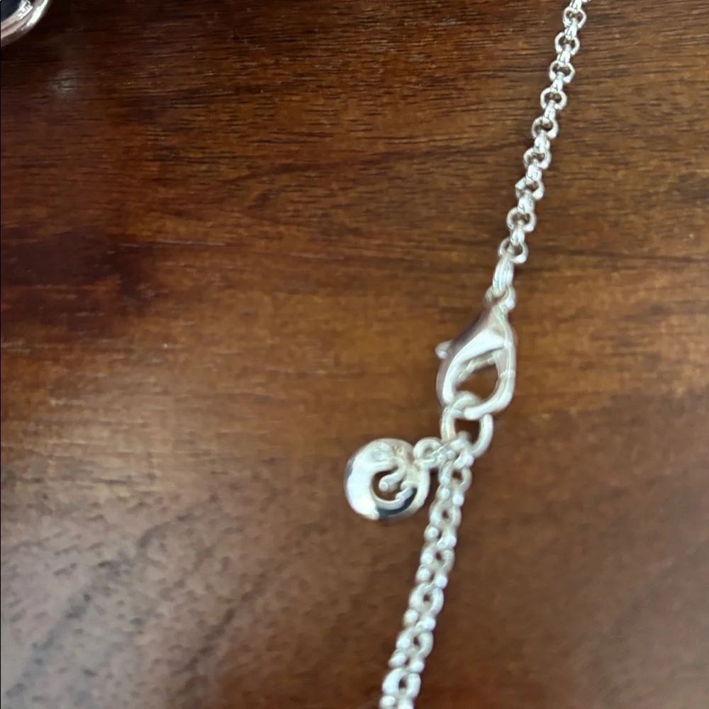 Gloria Vanderbilt Reversible Silvertone chain,teardrop w/blue & clear stones